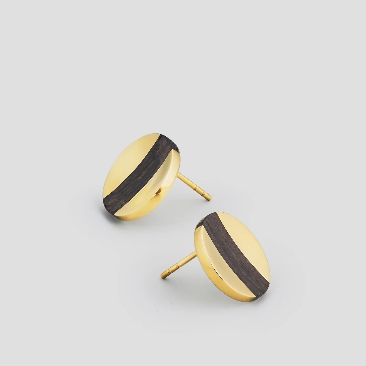 Gold stud earrings with dark inlaid bands by Kinraden